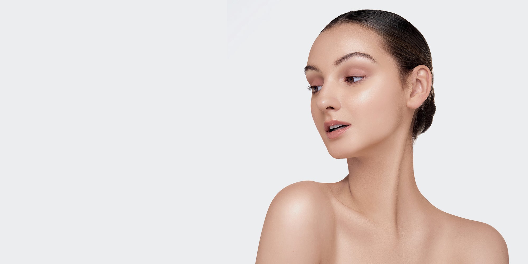 Header with woman looking at skincare in Perth