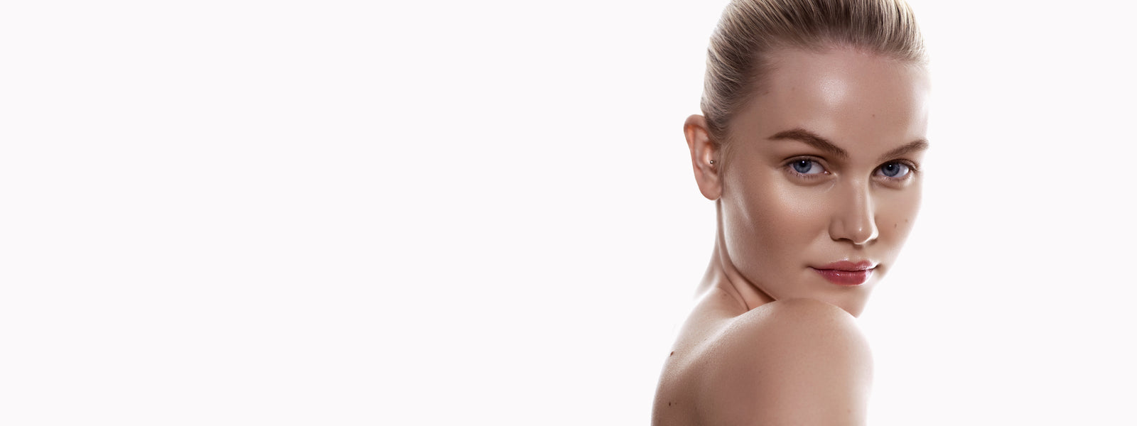 woman eyeing off the skincare available at the Perth shop
