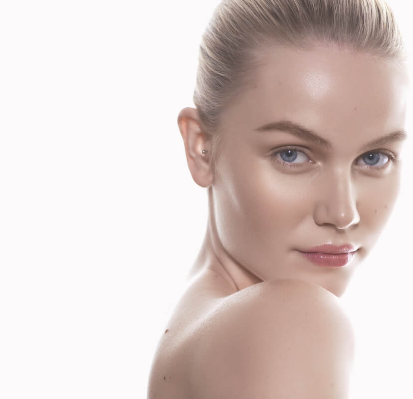 woman looking directly at you with well moisturised skin